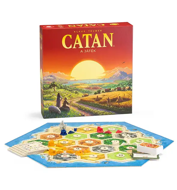 Catan társasjáték doboz és hatszögletű sziget játék felállítása erőforrás lapokkal és játékos figurákkal